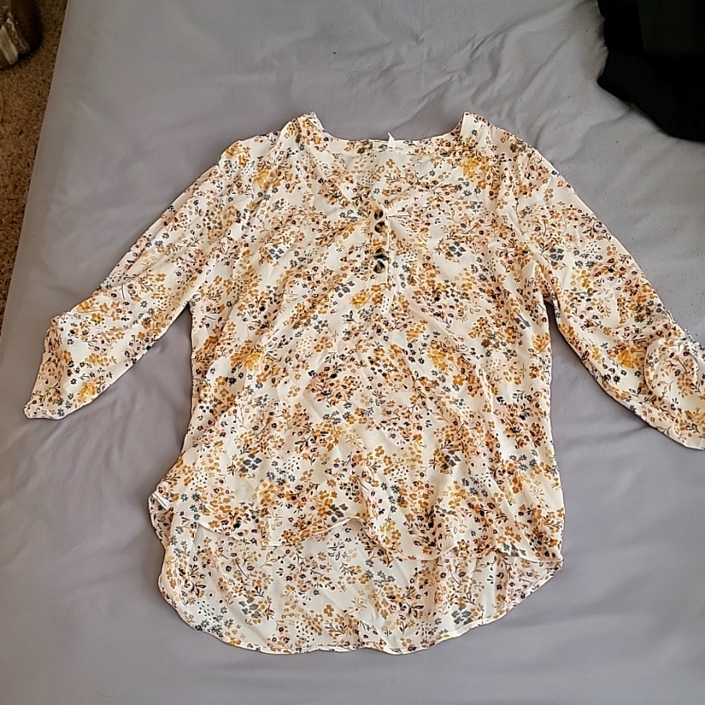 Matrices medium sized white blouse with yellow, blue, and pink flowers